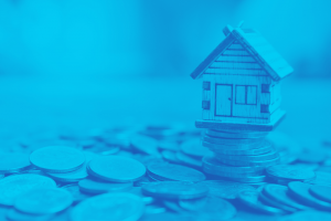 Miniature house on top of a stack of coins with bright blue overlay